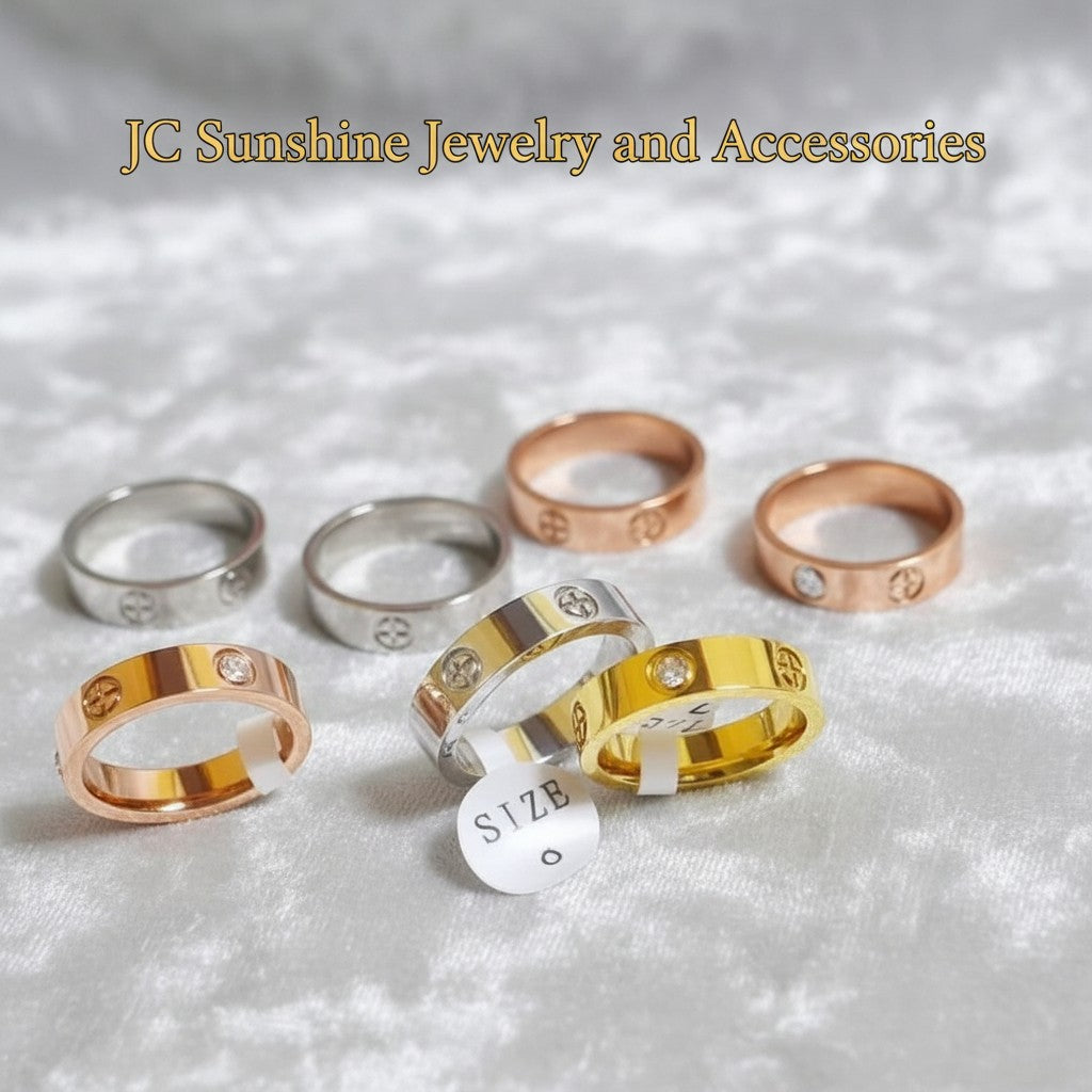 JC Sunshine Jewelry and Accessories rose gold, silver, and gold stainless steel rings with CZ crystals and cross detail. Classic style, 5mm width.